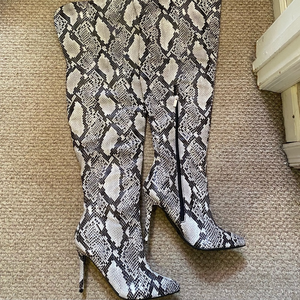 Thigh high snakeskin boots